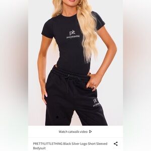 PRETTYLITTLETHING Black Silver Logo Short Sleeved
Bodysuit